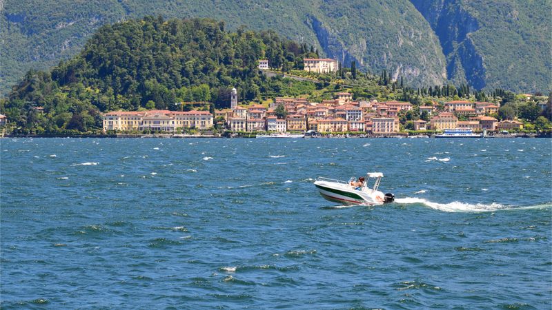 Rent a Boat for the Day: Croatia vs Riviera vs Lake Como Motorboat on Lake Como, with Bellagio in the background