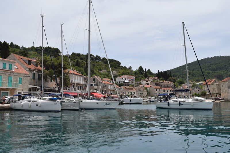Rent a Boat for the Day: Croatia vs Riviera vs Lake Como Sailboats moored in a Dalmatian coastal village, Croatia