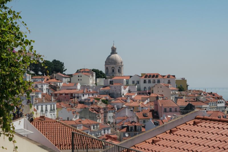 National Pantheon dome rising above Alfama's terracotta rooftops