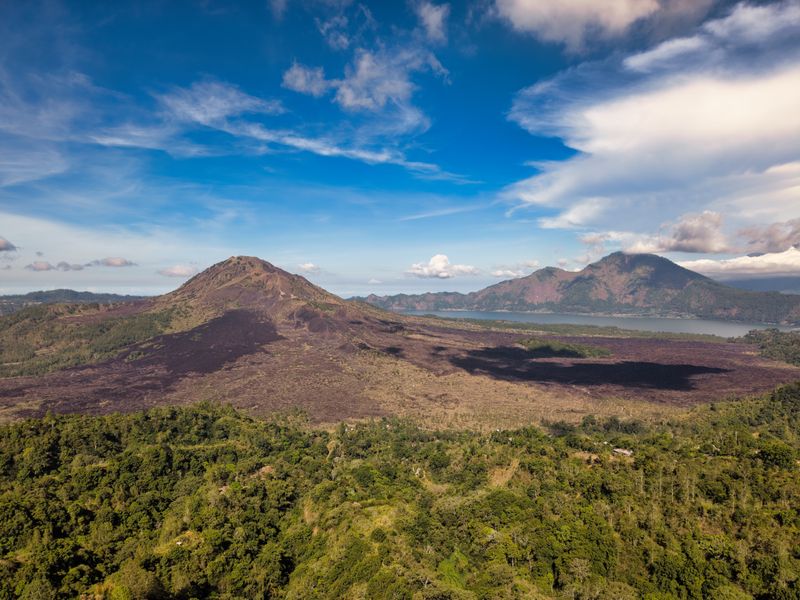 Aerial view of Batur's volcanic caldera and lake beyond