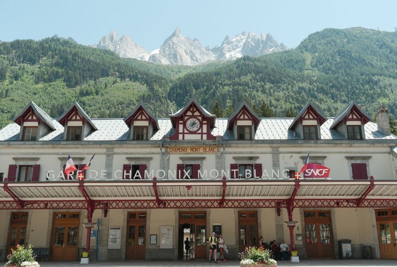 Chamonix Mont-Blanc train station facade with jagged peaks behind