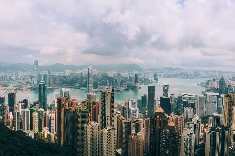 Aerial Victoria Peak view of dense towers and harbor